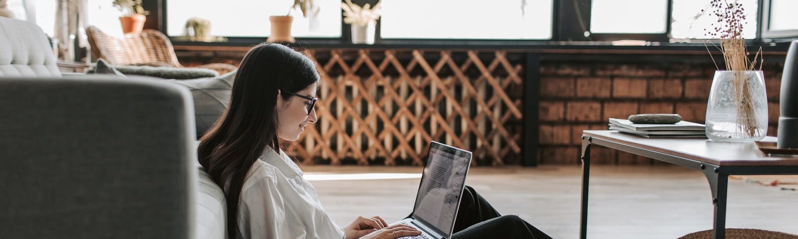 Woman sitting in front of laptop