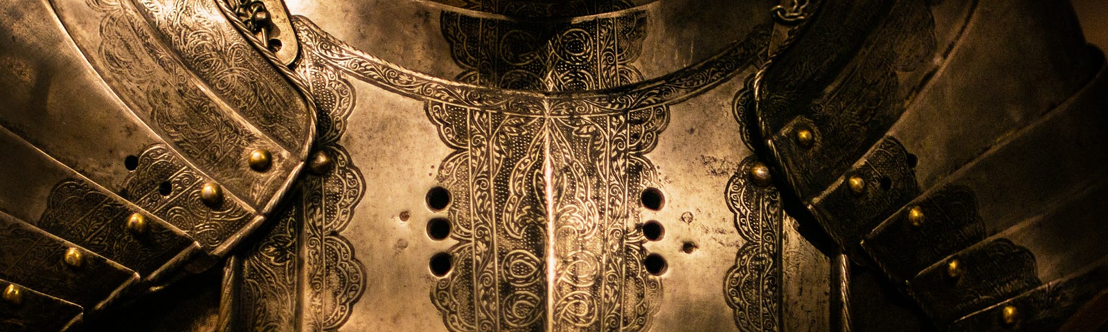 The chest of a golden suit of armour.