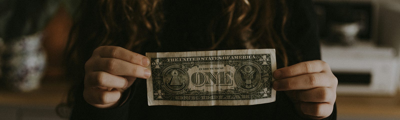 woman with single dollar
