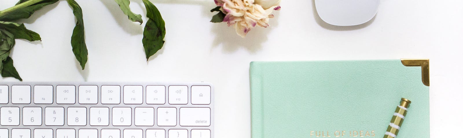 keyboard, light pink rose, computer mouse, pen and journal