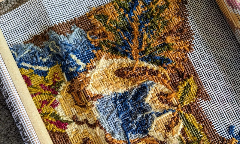 The reverse side of a piece of tapestry.