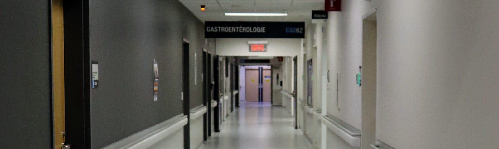 empty hospital hallway with an empty bed