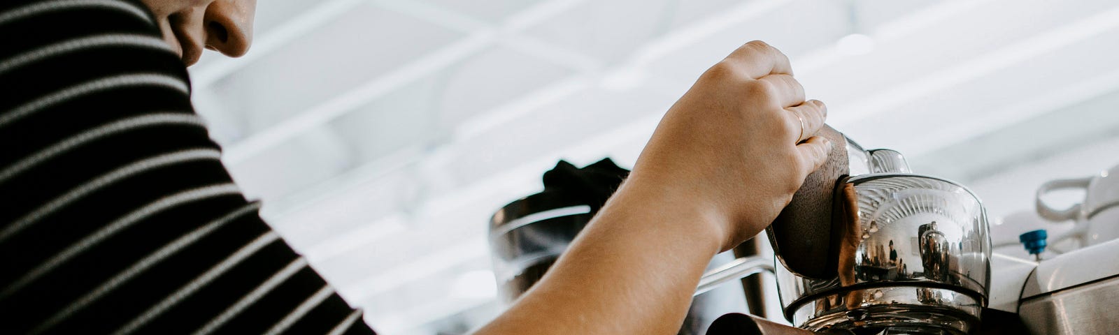 Barista preparing a cup of espresso