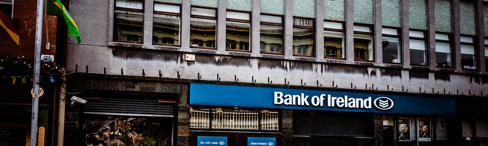 pic shows “The Bank of Ireland” — brick and mortar location