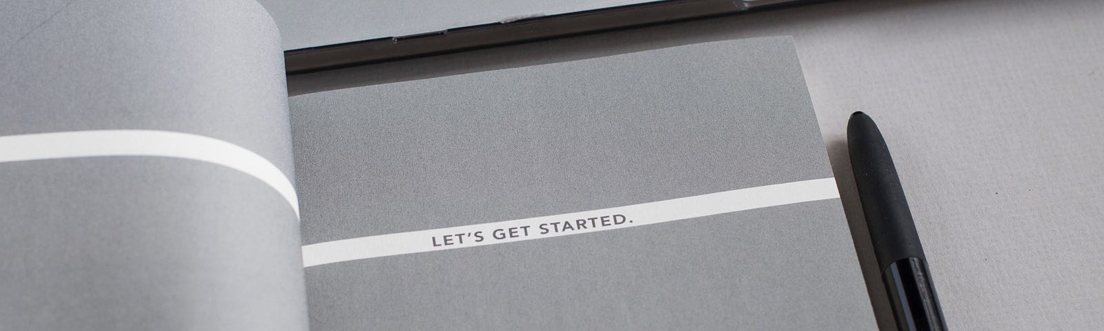 A gray book that reads “Let’s get started”.