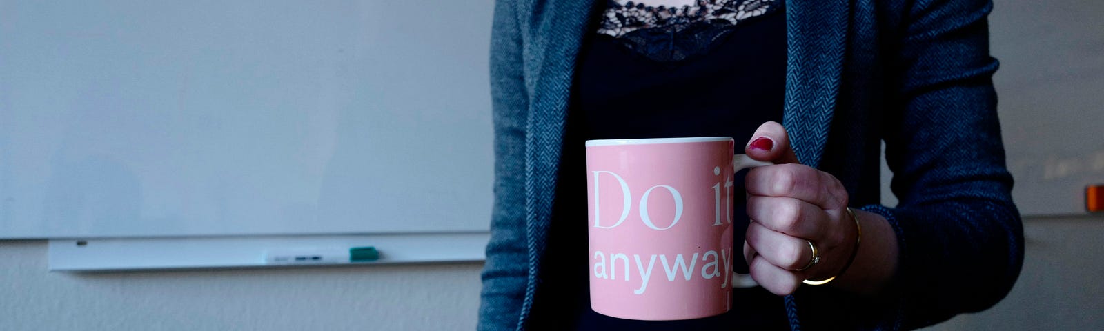 Woman Boss with Mug That Says “Do It Anyway”