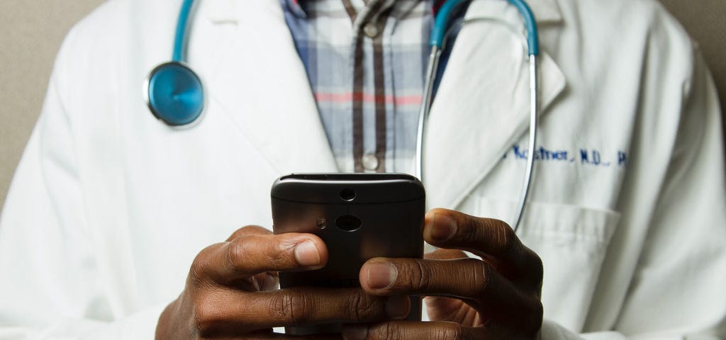 A doctor using his smartphone