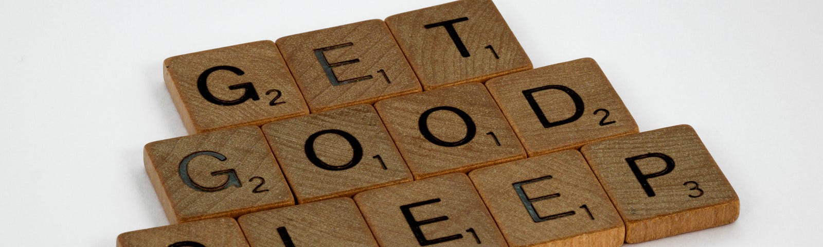 Scrabble tiles that spell “Get Good Sleep”