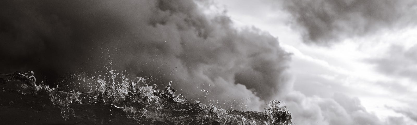 A grayscale photograph of a storm-tossed sea