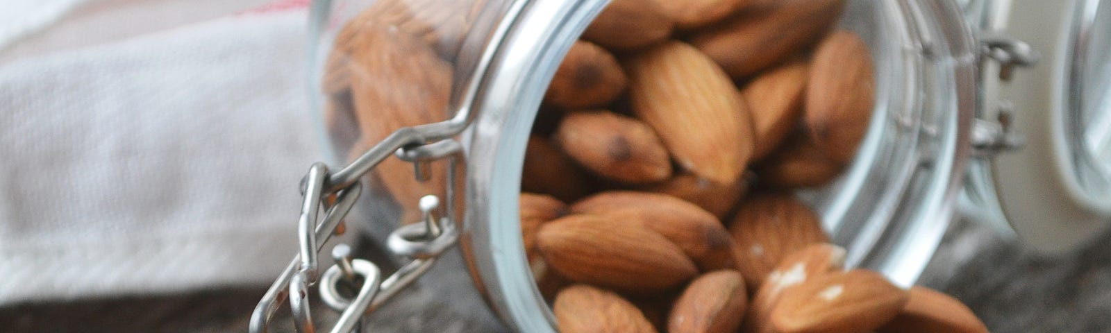 Photo of almonds in a jar.