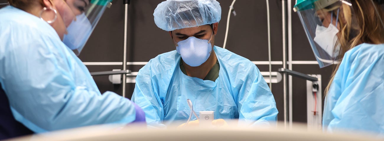 Clinicians work on intubating a COVID-19 patient in Louisiana.