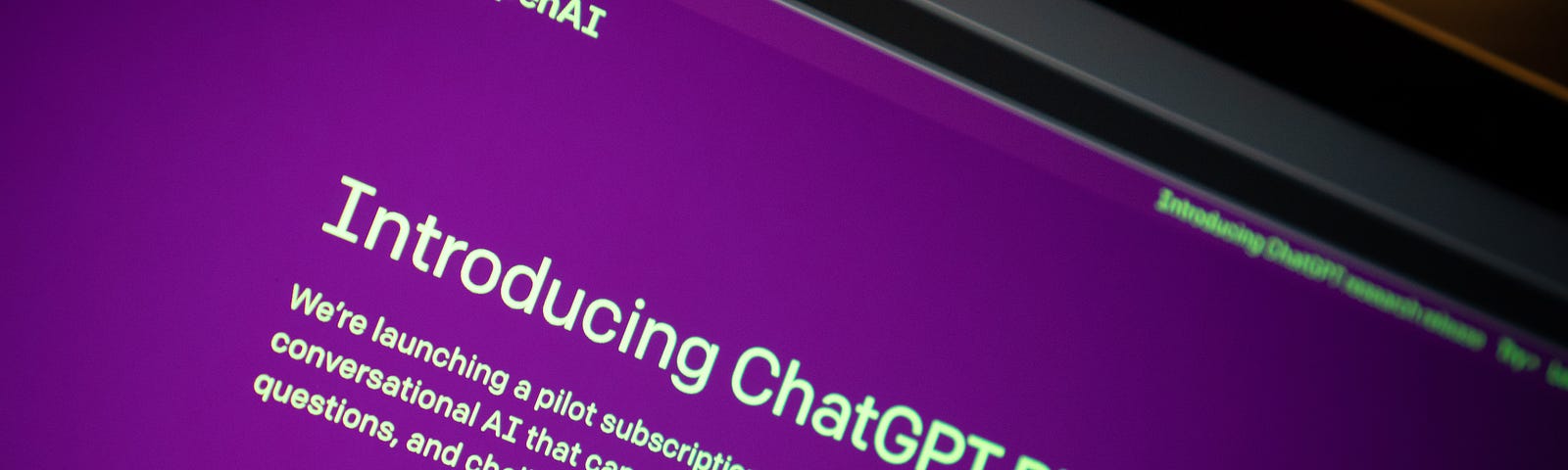 A photograph of one corner of a webpage — Introducing ChatGPT Plus