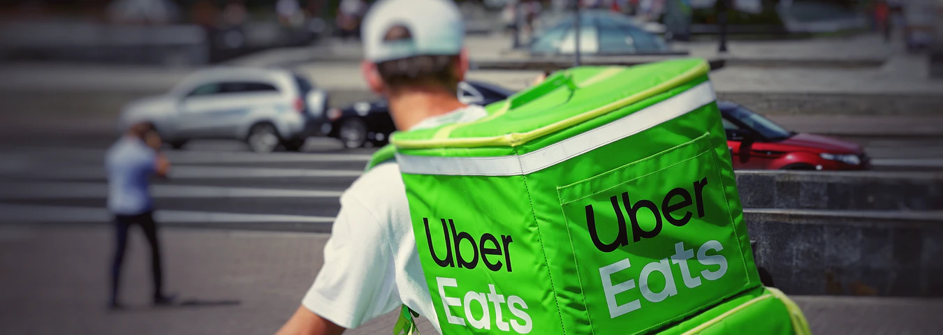 A driver from Uber Eats doing an on-demand delivery