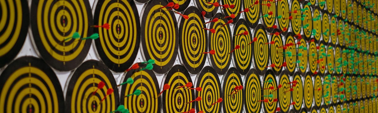 Hundreds of dart boards aligned in several rows.