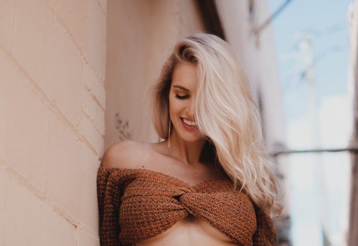 Sexy woman smiling shyly