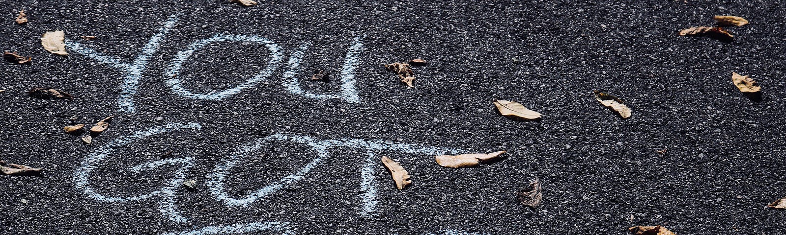 Chalk writing on the ground “You Got This.”