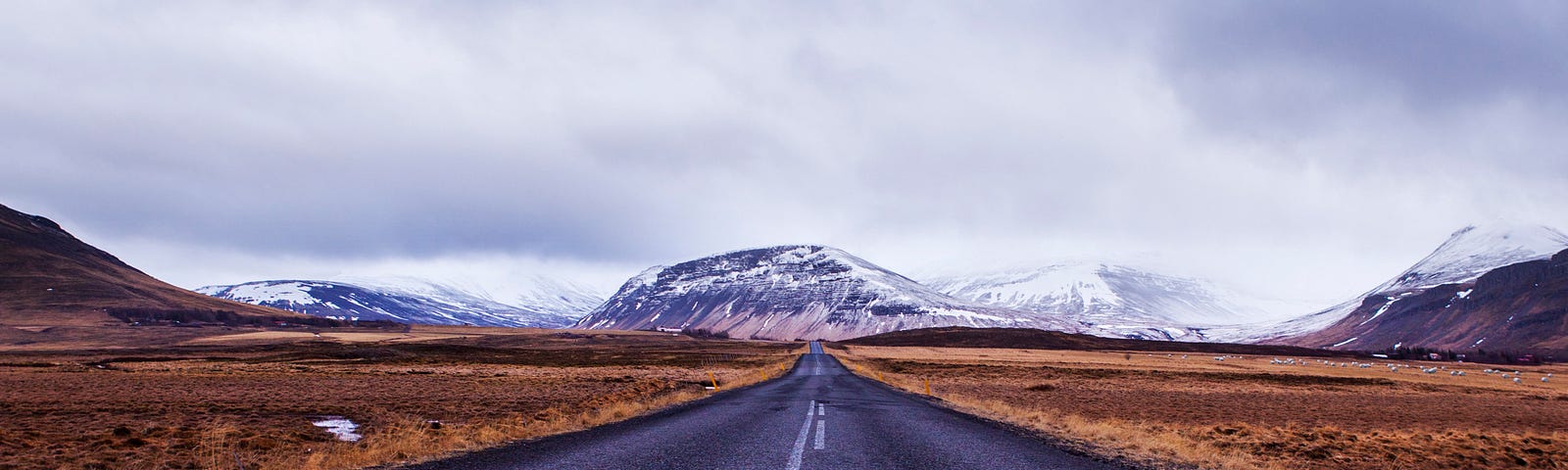 Road with fading center lane divider.