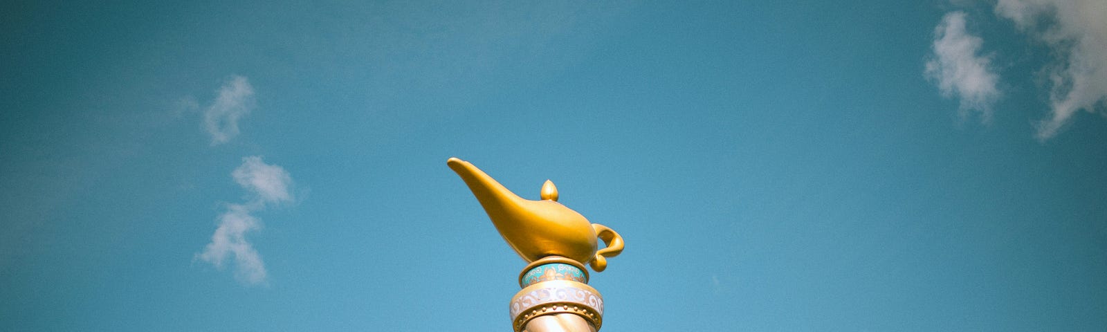 genie lamp on top of a pedastal of sorts