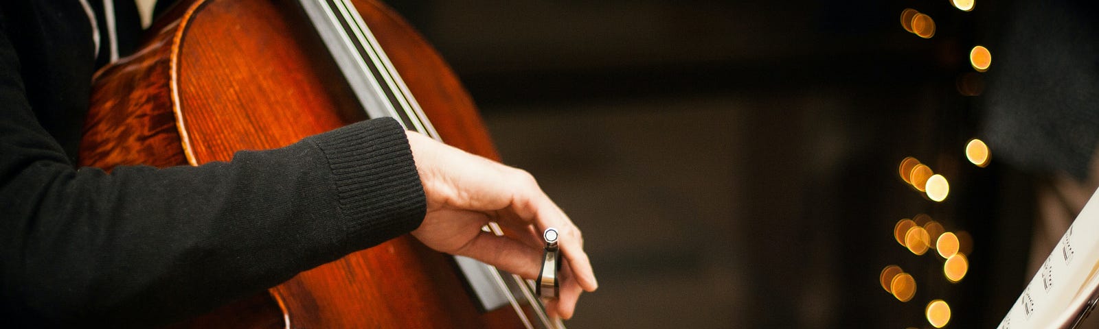 Doctor playing cello for dying patient