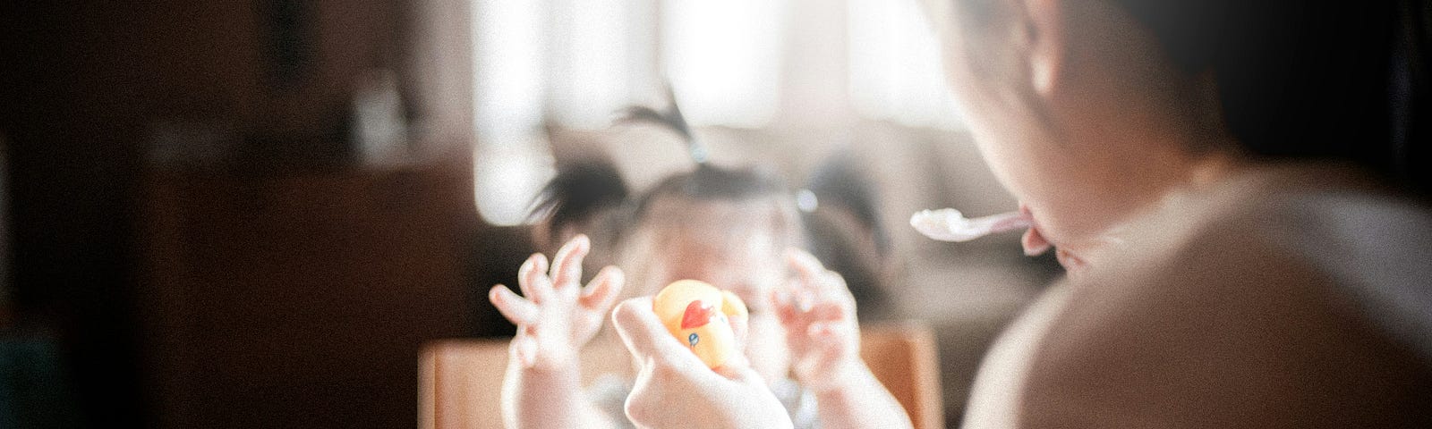 A mother feeding a child