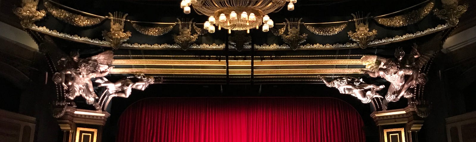 Closed red curtain in theatre