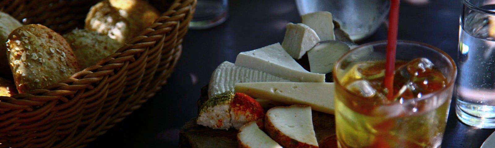 Cheeses, drinks and more on a table