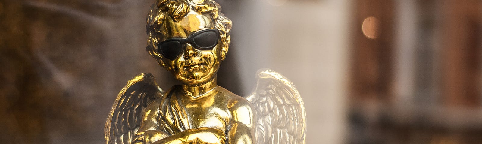 Bronze angel statute with sunglasses