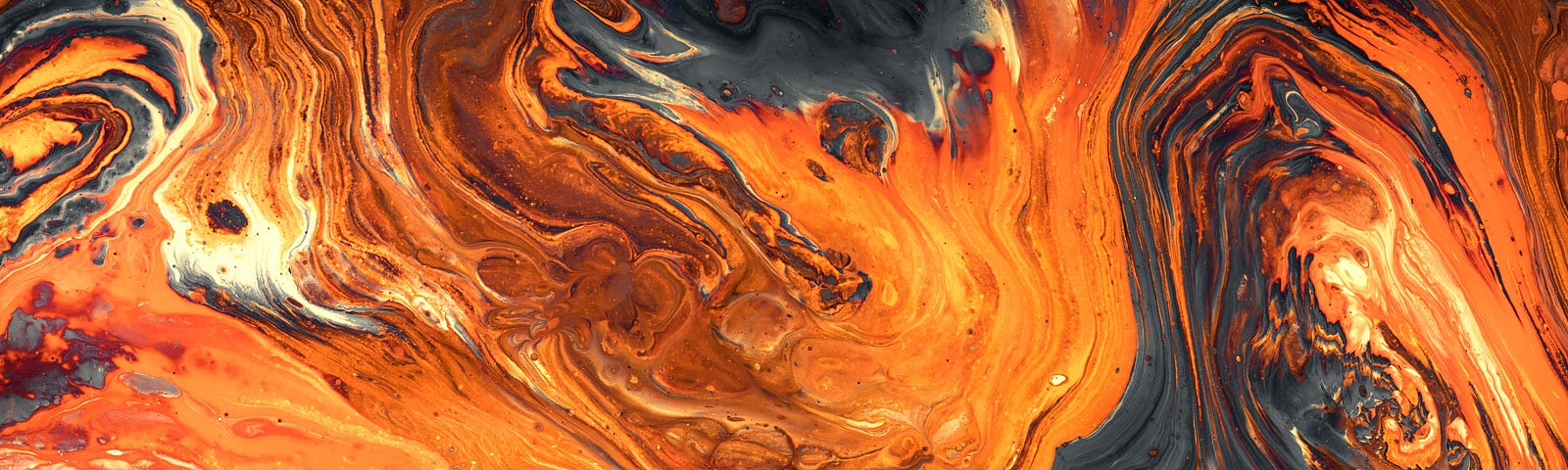 an image of orange, yellow and black swirls of paint