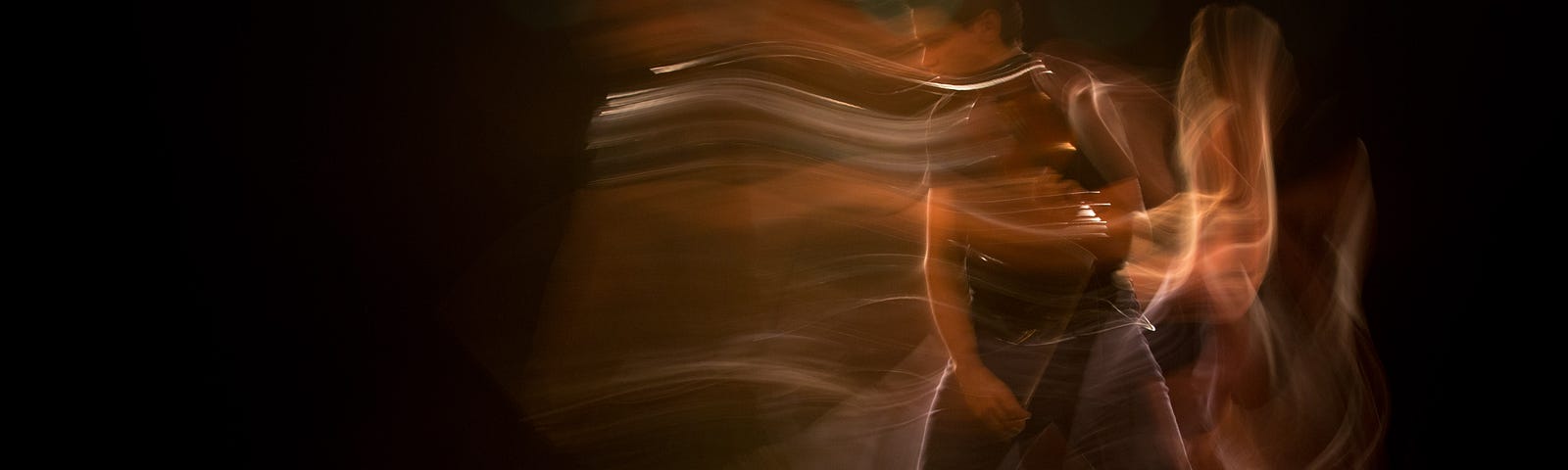 artsy time lapsed photo of a dancer moving across the stage