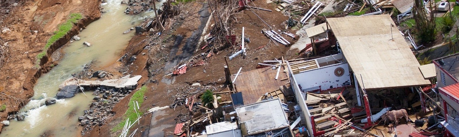 Aerial view of a damaged home in the mountainous area of Barranquitas, Puerto Rico, October 9, 2017. Photo by Andrea Booher/FEMA