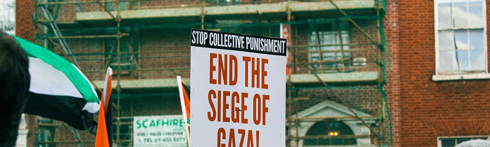Crowd with Sign — End the siege of Gaza!