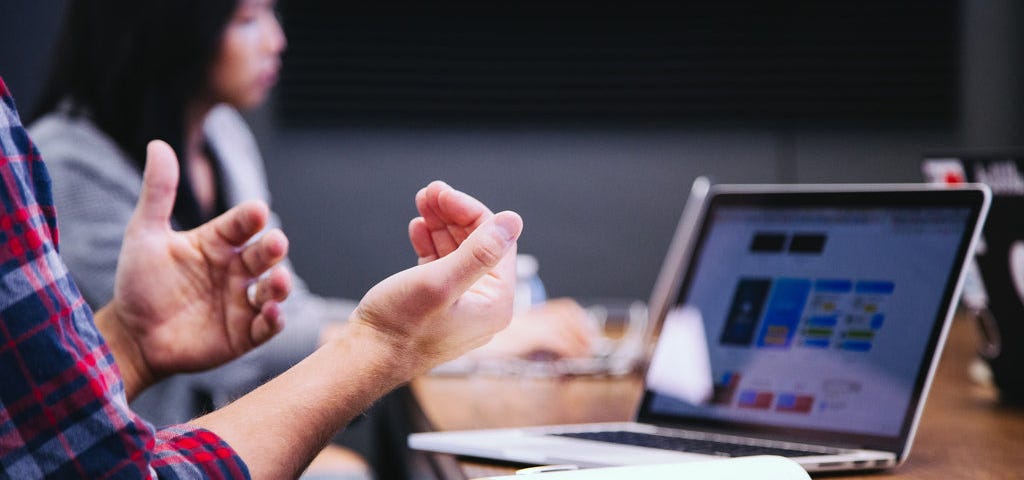 a laptop and hands of a male