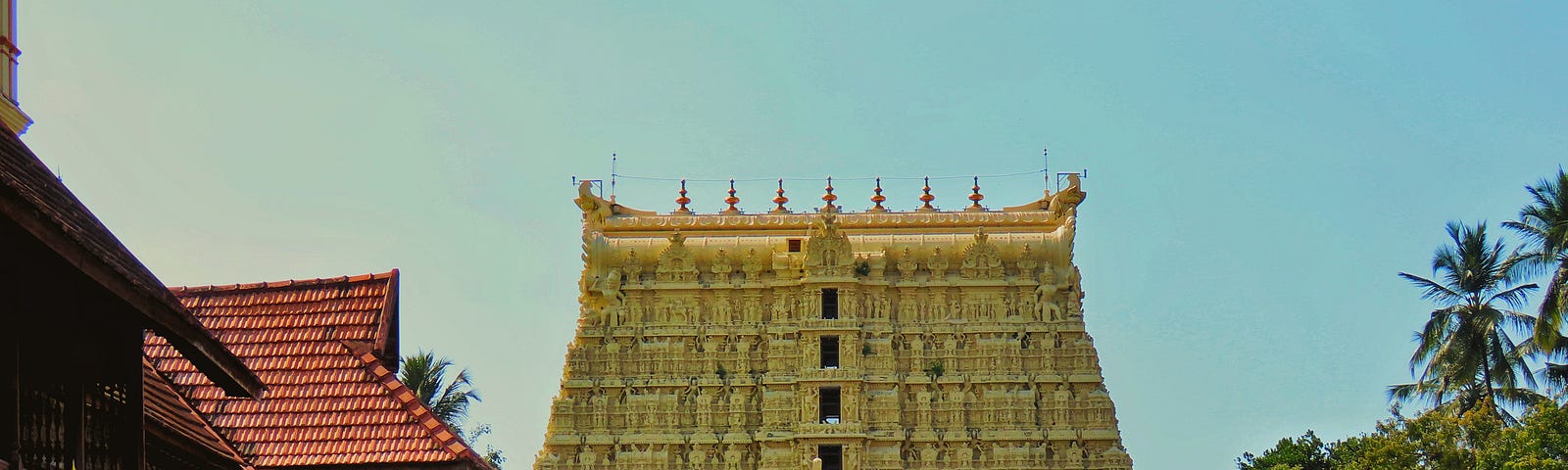 Shri Padmanabhaswamy Temple, adorned with thick plates of gold. Photo by Navaf Muhammed on Unsplash