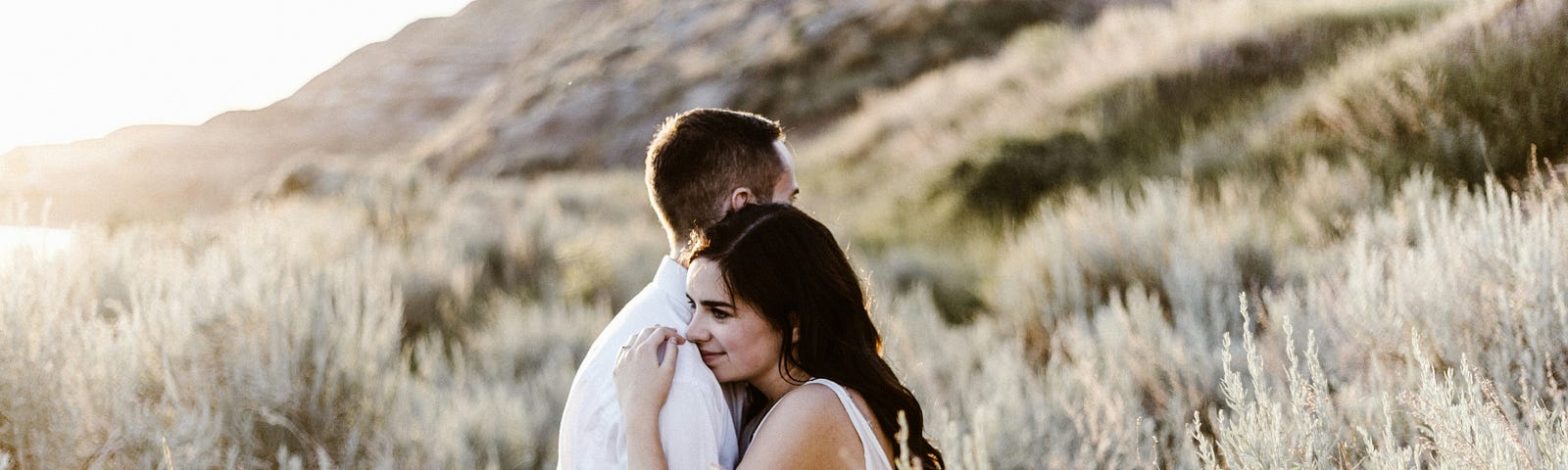 A man and a woman holding each other