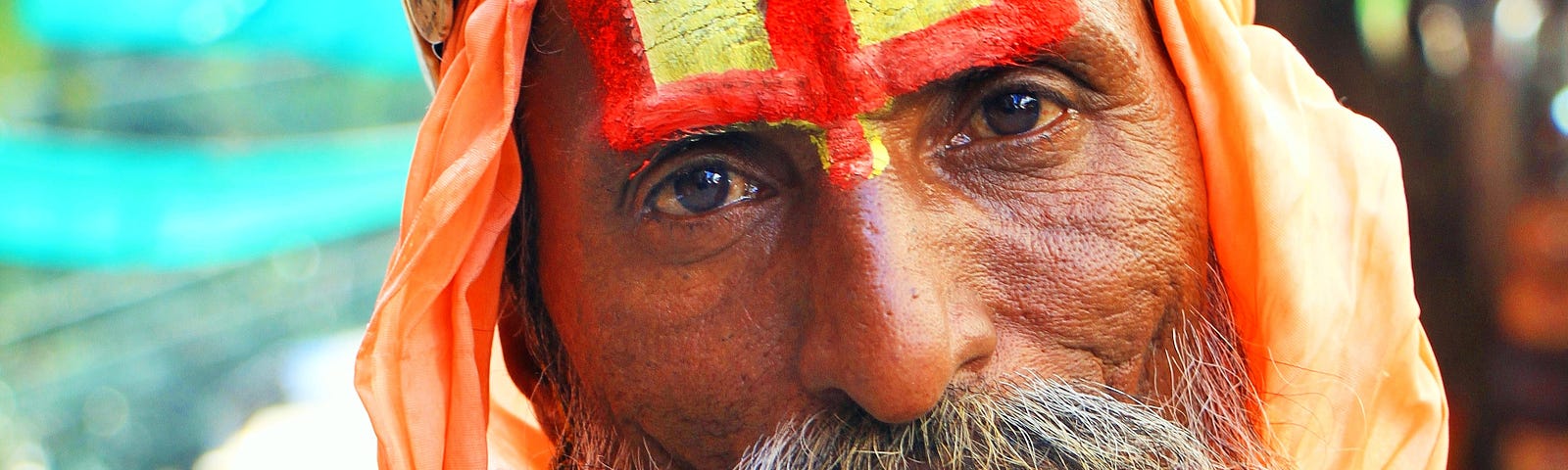 An indigenous wise man staring into the lens