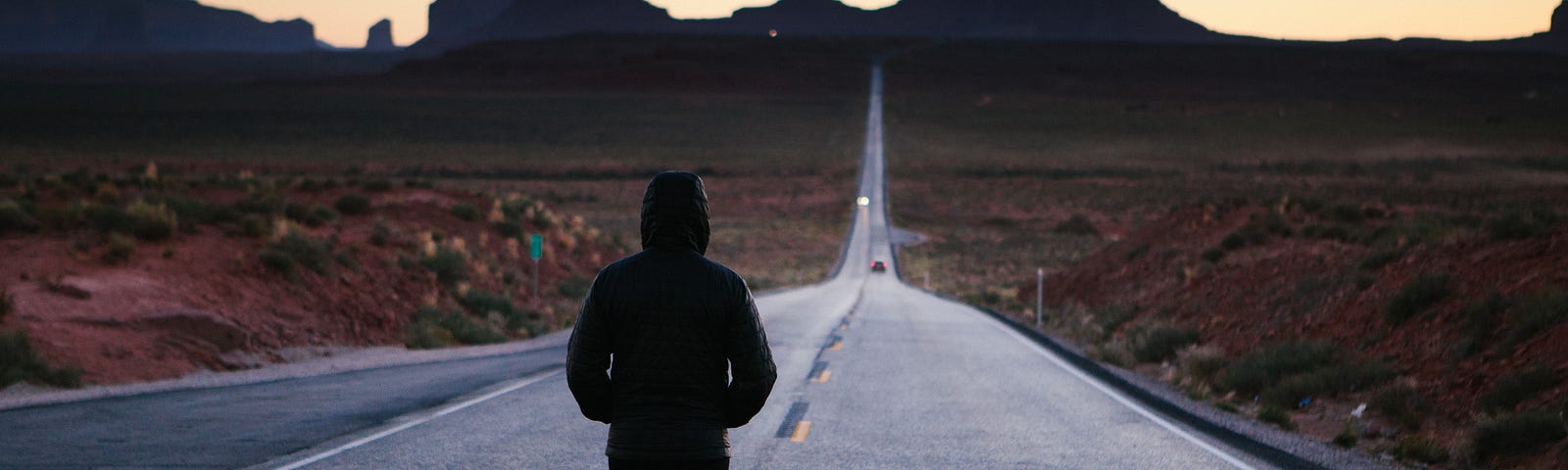 A person walking down a road that requires motivation to keep going.