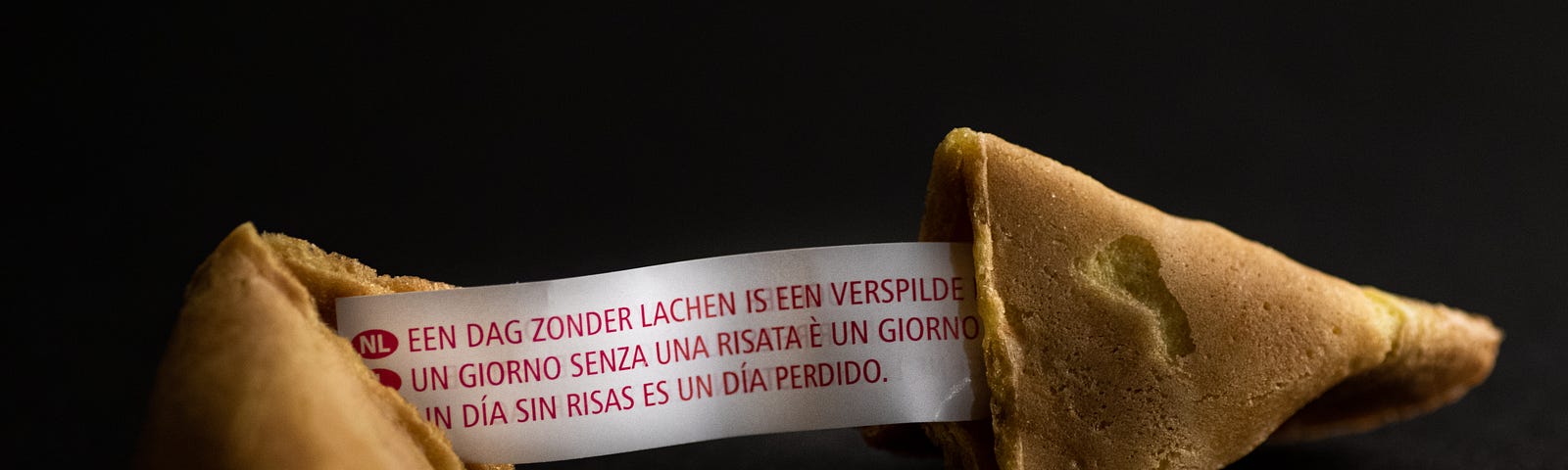 Fortune cookie split in two showing message inside