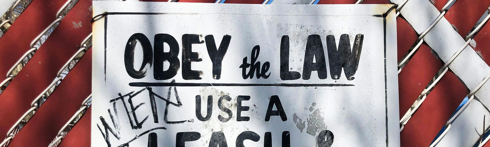 Sign — Obey the Law Use A Leash & Poop Scoop