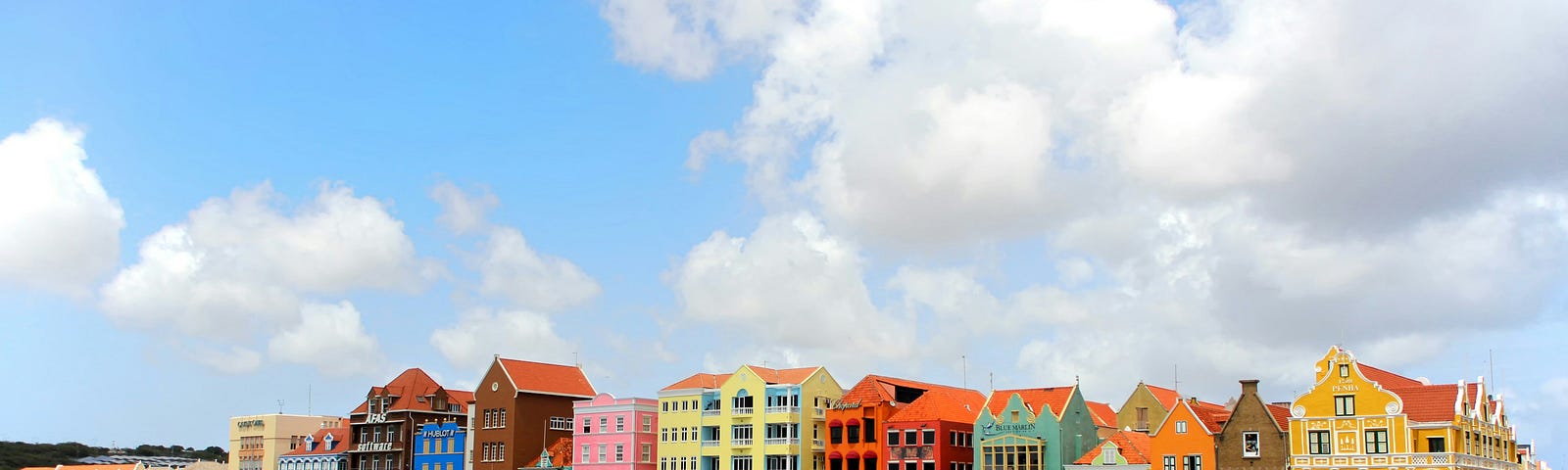 Vibrant pastel-colored buildings lined the harbor in Willemstad, Curaçao.