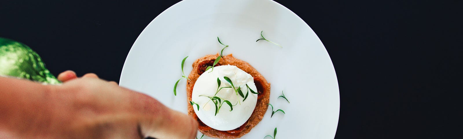 An appetizer on a small white plate.