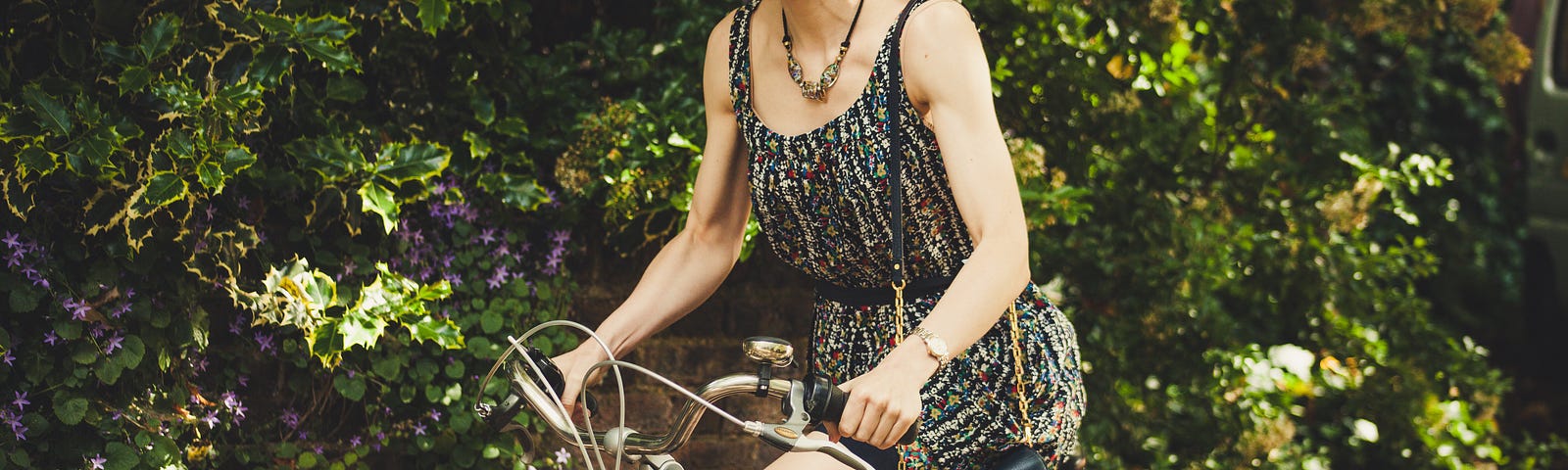 Here is a woman enjoying a ride on her bike, enjoying a simpler life, representing a contentment that comes with maturity and deeper understanding.