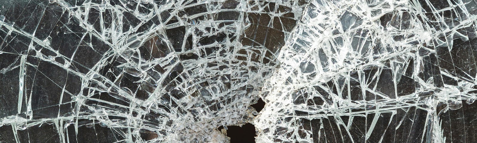 Shattered glass with two holes.