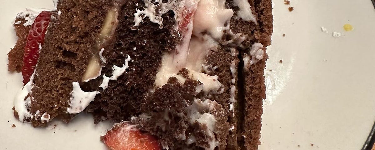 A traditional Danish birthday lagkage Chocolate cake layers, banana, strawberries, custard and no buttercream in sight.