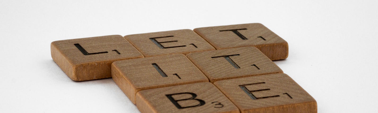 scrabble pieces spell” “Let it be”