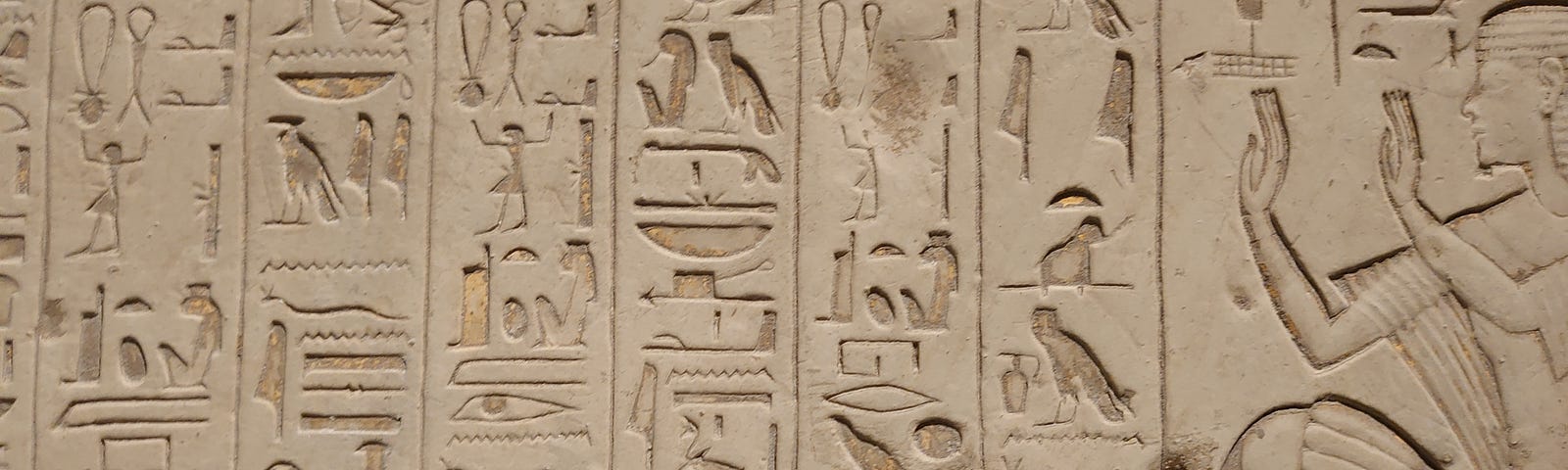 An image of hieroglyphs engraved on a wall