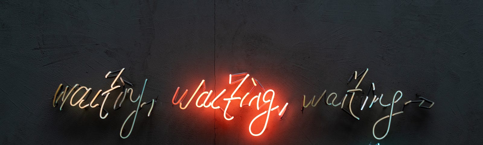 Neon sign reading ‘waiting, waiting, waiting, waiting…’