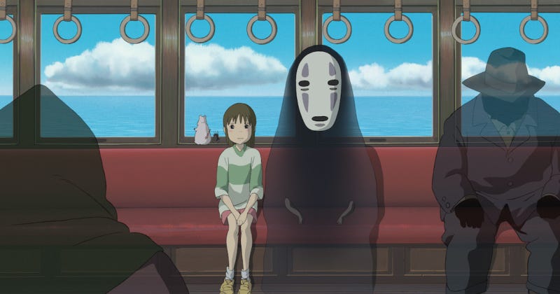 Chihiro and No Face ride on the train to go see Zeniba.