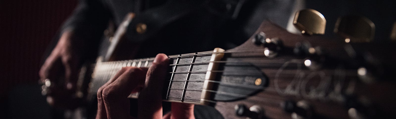 Person playing the guitar