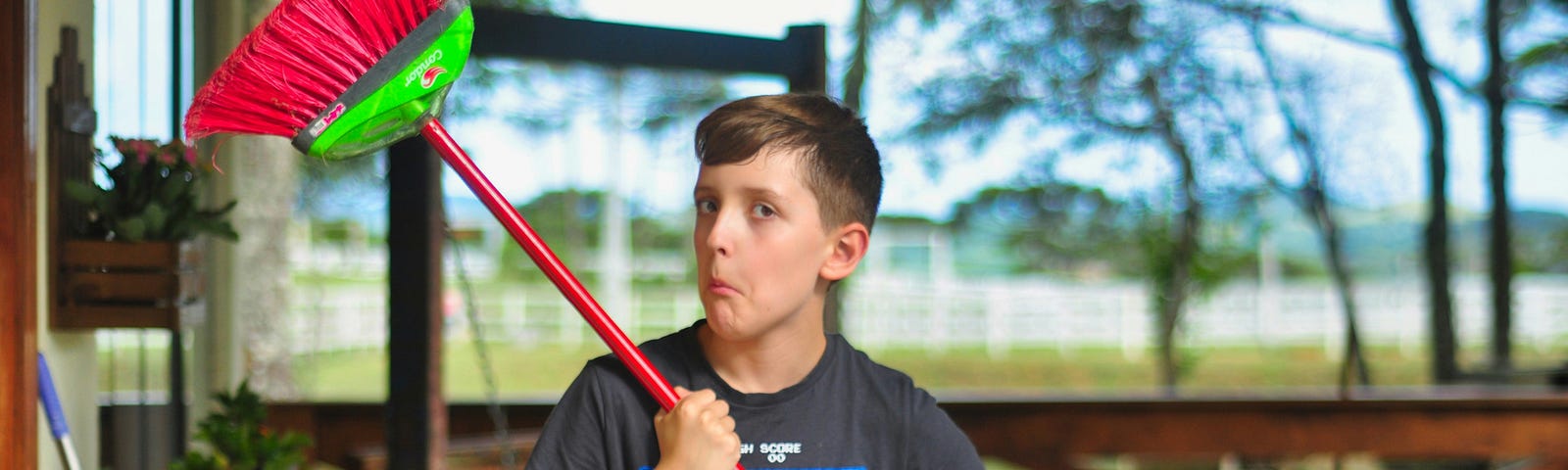 Teen with a broom