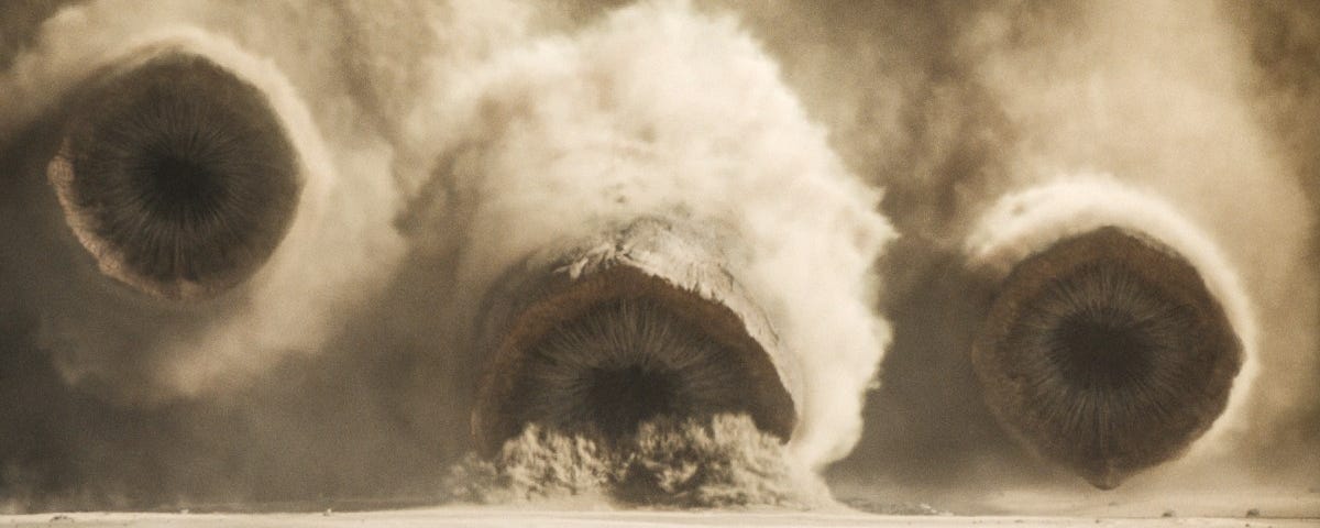 A still of the sandworms attacking the Sardukaur from Dune: Part Two.